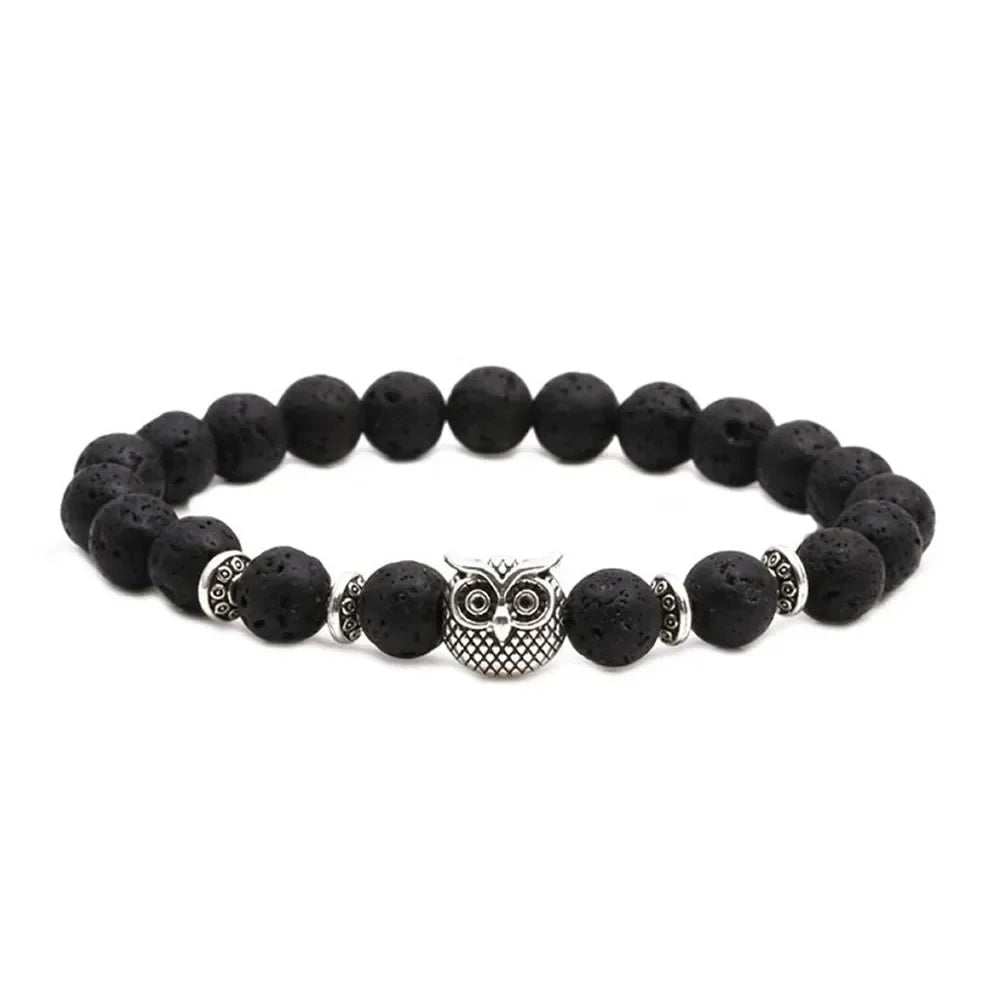 Black lava stone beaded bracelet with silver owl charm and decorative spacer beads