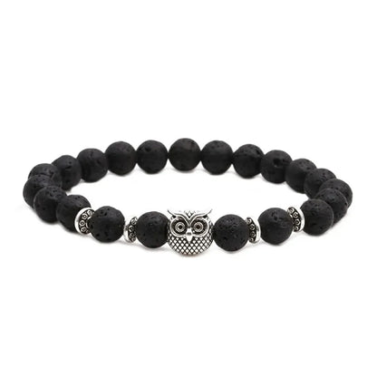 Black lava stone beaded bracelet with silver owl charm and decorative spacer beads